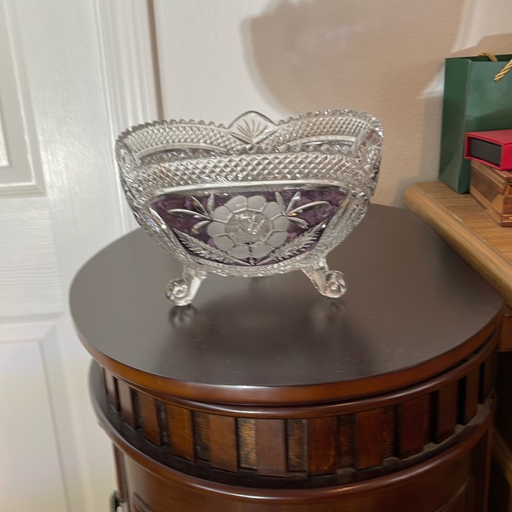 Glass bowl with burgundy color inlay around etched flowers.